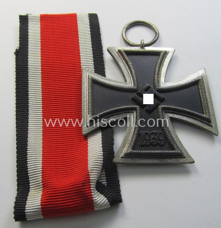 'Eisernes Kreuz II. Klasse' being a non-maker-marked example that comes together with its original- and once-mounted ribbon (ie. 'Bandabschnitt') as was produced by a (by me) unidentified maker (ie. 'Hersteller')