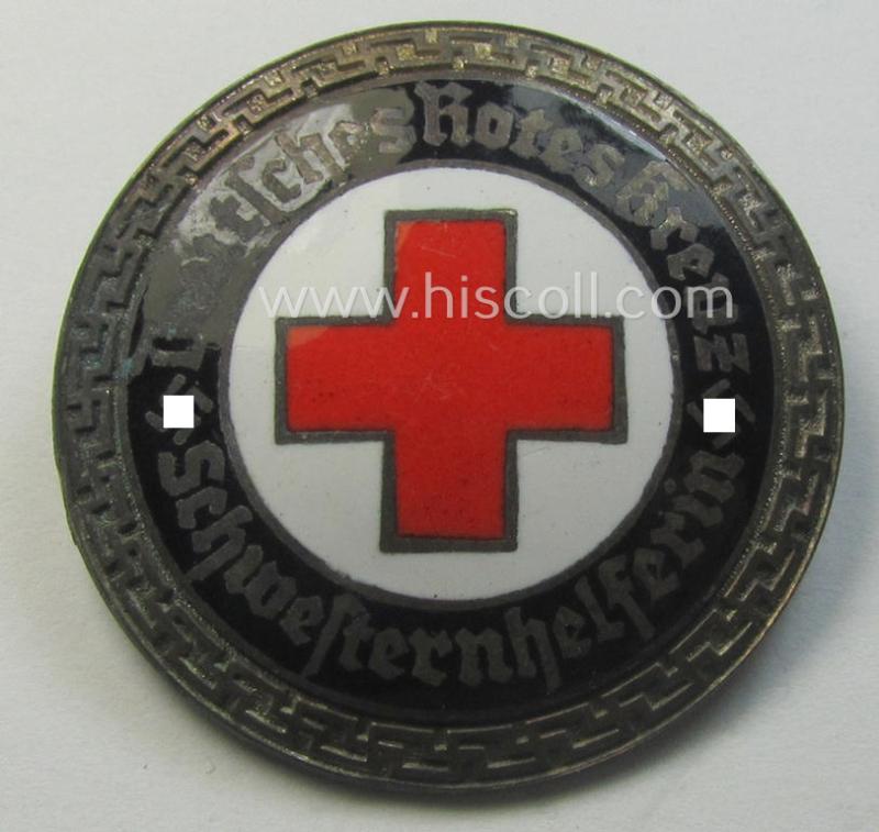 Attractive - and nicely preserved! - 'Buntmetall'-based, DRK (ie. 'Deutsches Rotes Kreuz' or German Red Cross) nurses'-helpers-badge entitled: 'Schwesternhelferin' (being an example that shows a: 'Ges.Gesch.'- patent-pending-designation