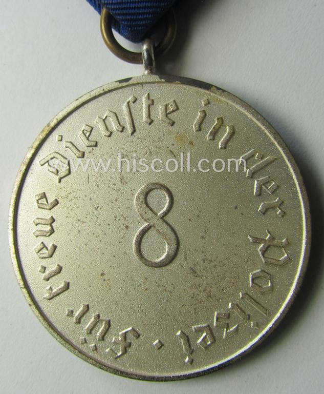 Superb, bright-silver-toned so-called: 'Polizei-Dienstauszeichnung 3. Stufe' (or: police loyal-service medal 3rd class) that comes mounted onto its period ribbon (ie. 'Bandabschnitt') and that comes stored in its scarcely seen, green-coloured etui