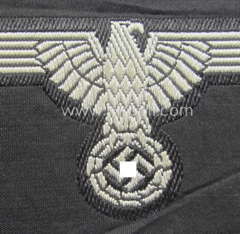 Mid- (ie. later-war-) pattern, 'SS' (ie. 'Waffen-SS') so-called: 'BeVo-weave-style', enlisted-mens'- ie. NCO-pattern arm-eagle (ie. 'Ärmeladler für Mannschaften u. Unterführer') as was intended for usage by the various Waffen-SS troops