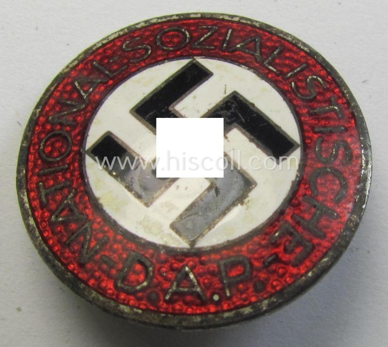 Neatly enamelled- (and darker-red-coloured) 'N.S.D.A.P.'-membership-pin- ie. party-badge (or: 'Parteiabzeichen') which is nicely maker-marked on the back with the (rarely seen!) makers'-designation: 'RzM' and/or: 'M1/128'