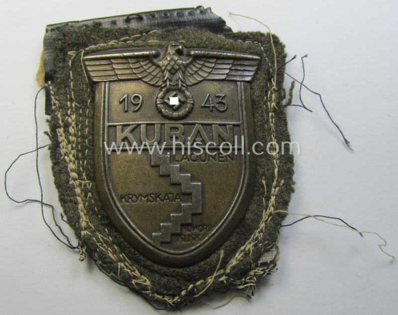 Attractive - truly worn and actually scarcely encountered! - WH (Heeres ie. Waffen-SS) 'Kuban'-campaign-shield that comes mounted onto its original field-grey-coloured- and/or woolen-based 'backing' as issued and/or used