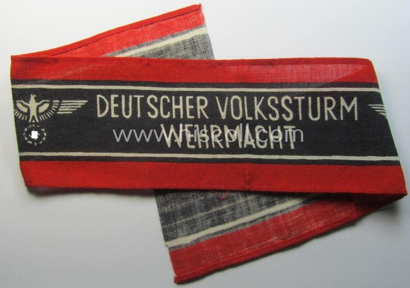Printed- and/or later-war-period, bright-red- and/or black-coloured so-called: 'Deutscher Volkssturm'-armband (ie. 'Armbinde') that comes in an overall very nice- (I deem issued- albeit never used- nor worn-), condition