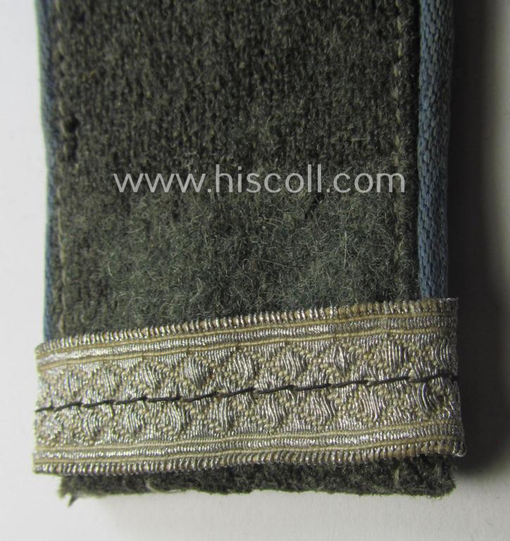 Single, mid-war period- (ie.: 'M43'-pattern) WH (Heeres) EM-type shoulderstrap: 'Soldat u. Offz.-Anw. einer Nachschub-Abtlgs.'