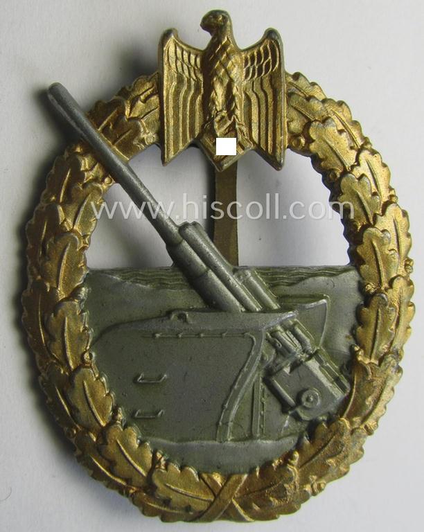 WH (KM) 'Marine-Artillerie-Abzeichen' being a maker- (ie. '45'-) marked- and/or zinc- (ie. 'Feinzink'-) based example by the: 'Franz Jungwirth'-company