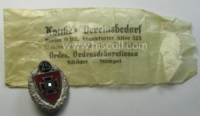 'Silberne Ehrennadel für 25 Jahre Mitgliedschaft im Nat.Soz. Reichskriegerbund' (ie. 'N.S.R.K.B.') being a maker- (ie. '6'-) marked example that comes stored in its period, 'Cellophan'-based pouch