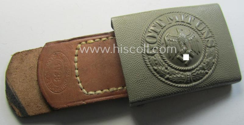 WH (Heeres) 'standard-pattern', field-grey-toned- and aluminium-based belt-buckle being a maker- (ie. 'R. Sieper & Söhne'-) marked- and/or: '1938'-dated example that comes mounted onto its leather-based tab