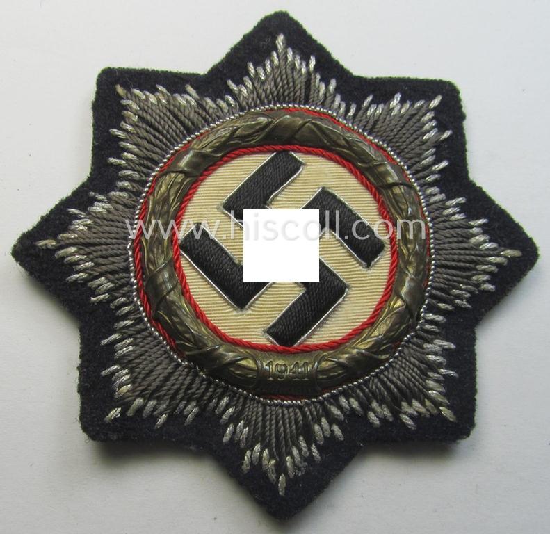 Black-toned, WH (Heeres o. Waffen-SS 'Panzer' ie. Kriegsmarine-related-) 'Deutsches Kreuz im Gold in Stoff' (ie. cloth-based DKiG or German Cross in gold)