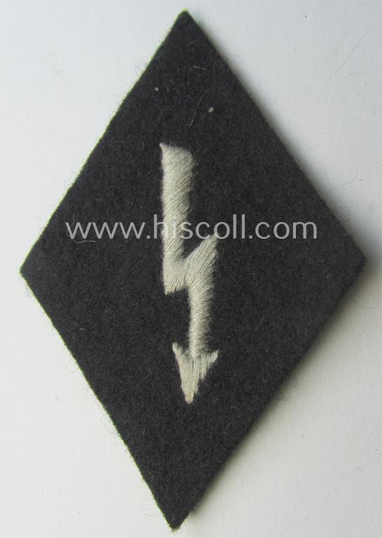 Waffen-SS-pattern, machine-embroidered and black-coloured sleeve-insignia (ie. 'Ärmelraute') depicting a: 'Signalblitz' ('SS-Nachrichten-Trpn.')