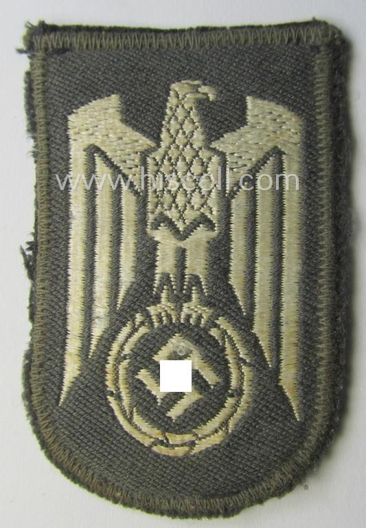 German Red Cross ('DRK' or: 'Deutsches Rotes Kreuz') tunic eagle-device (ie. 'Ärmeladler') as executed in 'BeVo'-weave-pattern