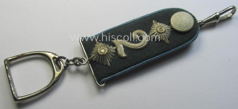 WH (Heeres) 'Nachschub'-related item: a semi-official, commemorative key-holder (aka: 'Url') depicting a (tiny) 'cyphered' shoulderstrap and chromed stirrup