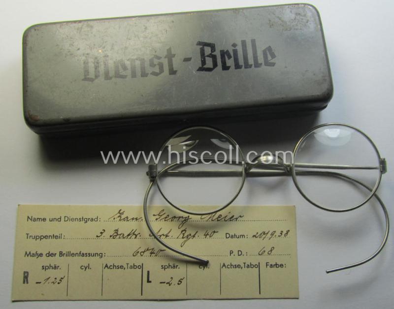 Complete pair of 'standard-issued'-pattern, WH-service-glasses (ie. 'Dienstbrille') as issued to the: 'Kan. Georg Meier' serving within the: '3. Batt. Art.Rgt. 40' and that comes stored in its period-container