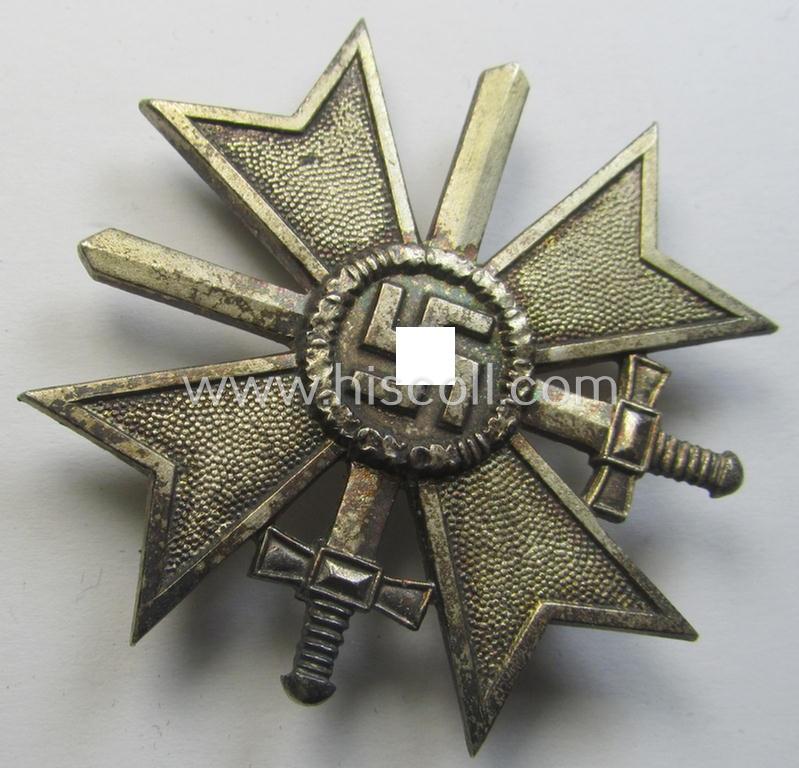 'Kriegsverdienstkreuz 1. Kl. mit Schwn.' being a maker- (ie. '4'-) marked and/or: 'Buntmetall'-based specimen by: 'Steinhauer & Lück'