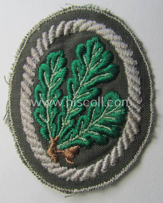 WH (Heeres) 'Jäger'-arm-badge being a desirable 'variant-pattern'-example as was executed in the machine-embroidered style on a thin-shaped- and/or linnen-based background