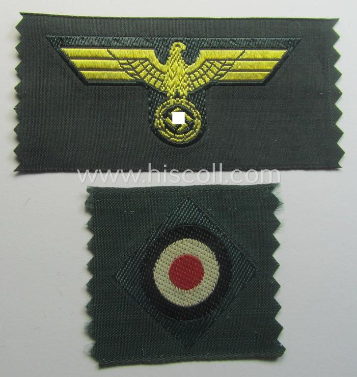 WH (KM ie. 'Küsten-Marine o. Marine-Art.') side-cap-eagle and cocarde-set (being a 'virtually mint- ie. unissued' set as executed in golden-yellow-coloured linnen on a darker-green-coloured background)