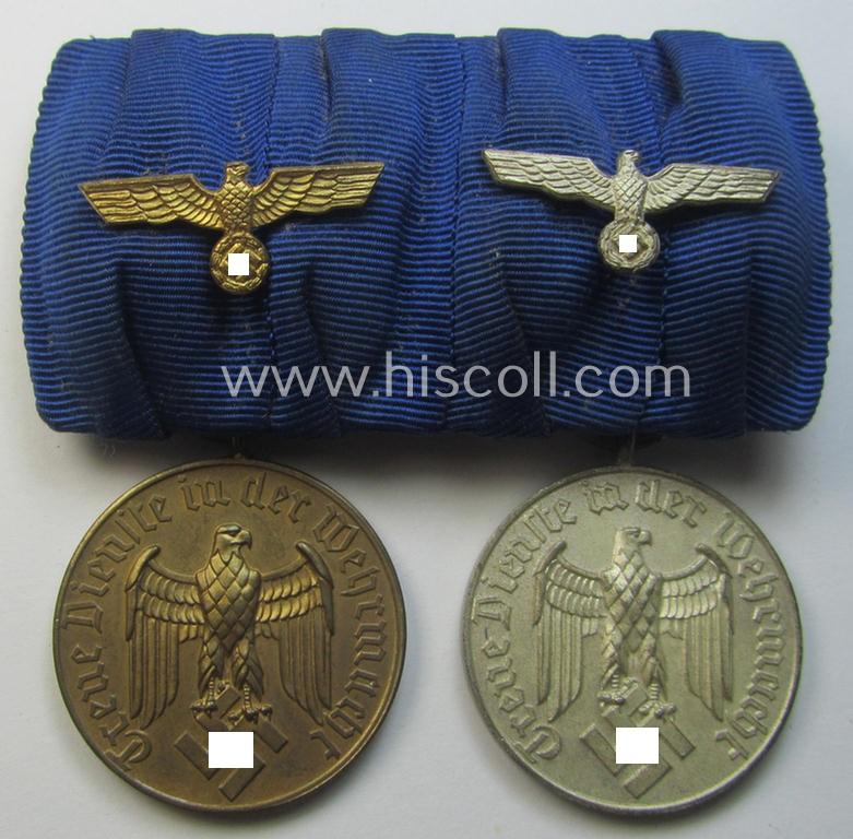 2-pieced medal-bar (ie. 'Spange') showing two: WH (Heeres o. Kriegsmarine) so-called: 'Dienstauszeichnungen für 4 u. 12 Jahre Treue Dienste' that both come period-mounted as a so-called: 'Doppelspange'