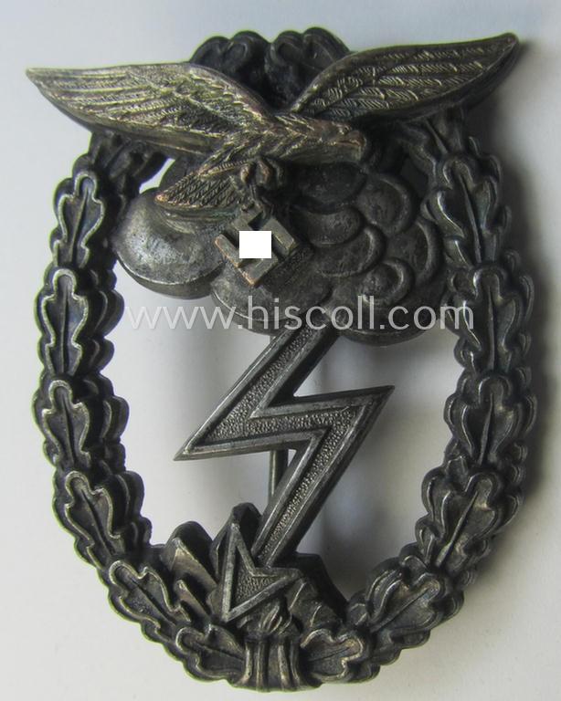 Mid- (ie. later-war-) period, zinc- (ie. 'Feinzink'-) based version of a WH (Luftwaffe) 'Erdkampfabzeichen' having a separate eagle-device attached and being a maker- (ie. 'G.B.' or 'Gustav Brehmer'-) marked example