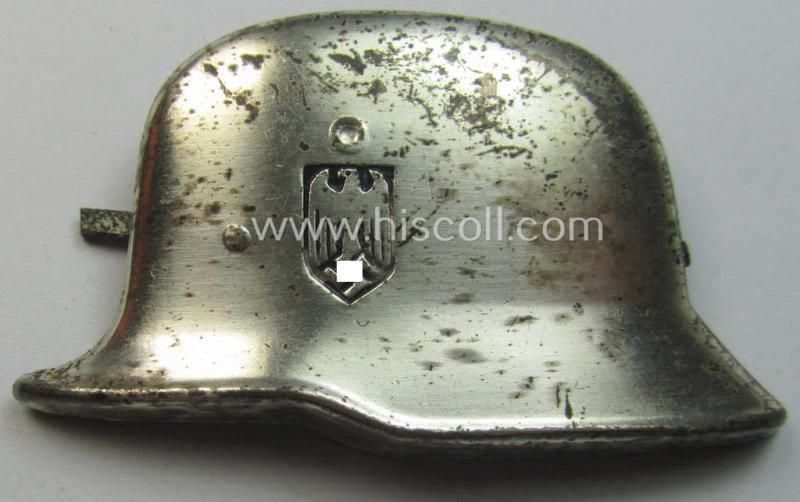 Bright-silverish-toned- (and I deem tin-based) so-called: 'photo-album-device' being a non-maker-marked example depicting a German steel-helmet