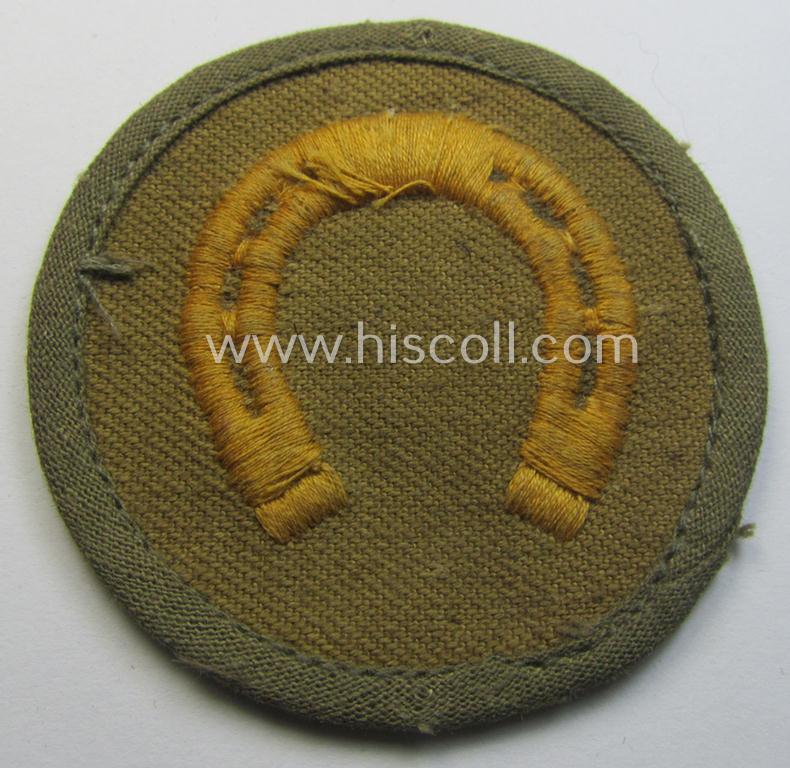 WH (Heeres) 'tropical'-issued, trade- and/or special-career insignia (ie. machine-embroidered 'Laufbahn- o. Tätigkeitsabzeichen') as was intended for an army: 'Hufbeschlagmeister' (or farrier)