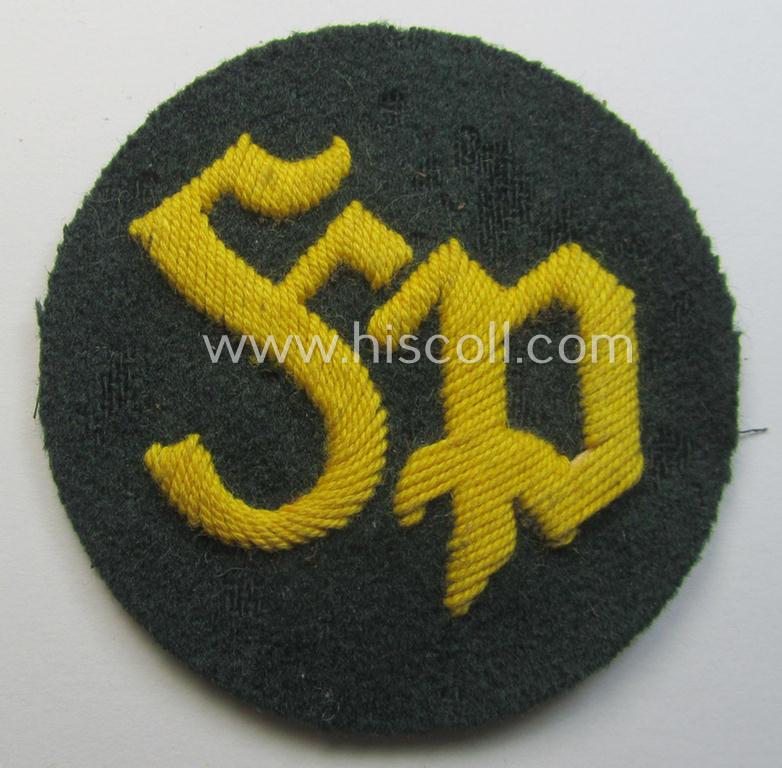 WH (Heeres) so-called: trade- and/or special-career arm-insignia as was intended for a: 'Festungspionier-Feldwebel' (being a neatly hand-embroidered variant mounted on darker-green-coloured wool)
