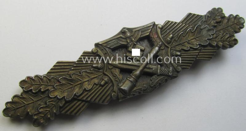 'Nahkampfspange in Bronze' (or: bronze-class close-combat clasp ie. CCC) being a maker- (ie. 'A.G.M.u.K.'-) marked- and/or minimal converse-shaped specimen having its period-attached (steel-based) 'back-plate' in place