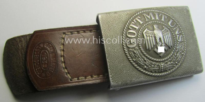 WH (Heeres) 'standard-pattern', field-grey-toned- and aluminium-based belt-buckle being a maker- (ie. 'Gebr. Gloerfeld'-) marked- and/or '1938'-dated example that comes mounted onto its leather-based tab