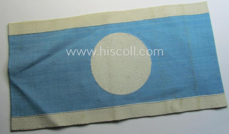 Linnen-based- and/or light-blue-coloured armband (ie. 'Armbinde') depicting an interwoven white-toned circle (ie. dot-) and dito white-coloured borders as was intended for usage by a: 'Luftschutzwart des Reichsluftschutz-Bundes'