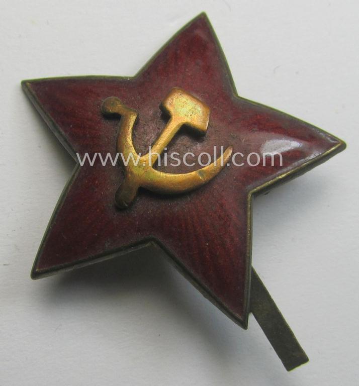 Unusal item that originated from a German soldier: a Russian, larger-sized and/or WWII-period, enamelled star-shaped cap-badge showing the communist logo on a bright-red-coloured surface