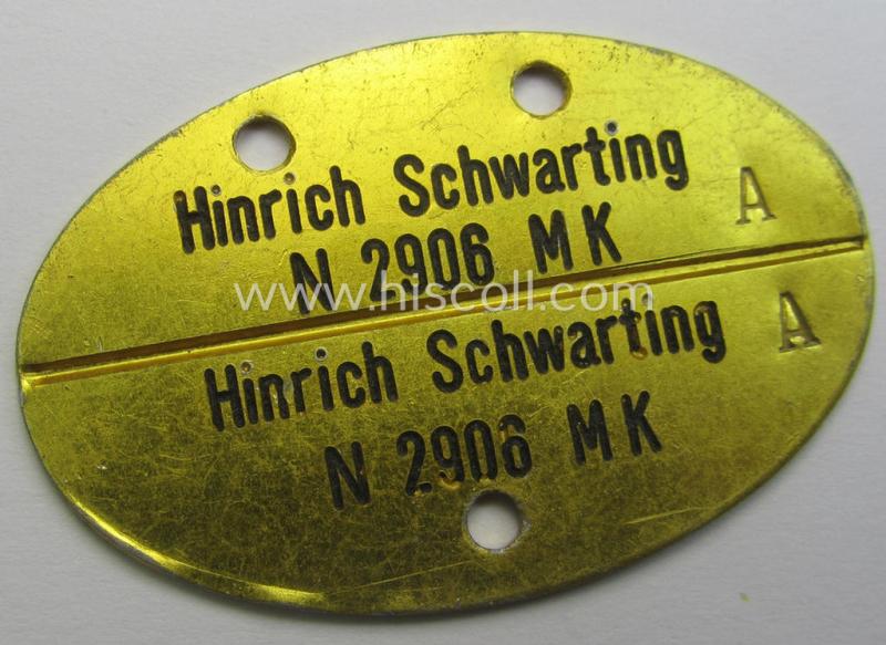 WH (KM) typical aluminium-based- and/or bright golden-bronze toned ID-disc (ie. 'Erkennungsmarke') bearing the engraved name and coded numeral (ie. text) that simply reads: 'Hinrich Schwarting N 2906 MK'
