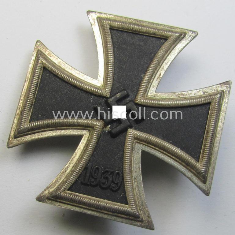'Eisernes Kreuz 1. Klasse' (ie. Iron Cross 1st class) being an (I deem) mid-war-period produced, neatly maker- (ie. '20'-marked thus by the maker: 'C.F. Zimmermann'-produced) example