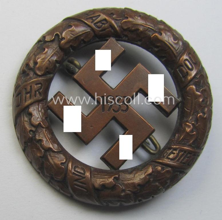 N.S.D.A.P.-related 'Tagungs- o. Veranstaltungsabzeichen' (also referred to as: 'Gau München'-honorary-badge) being a maker- (ie. 'Deschler'-) marked example showing the text: 'Und Ihr habt doch gesiegt - 1933!'