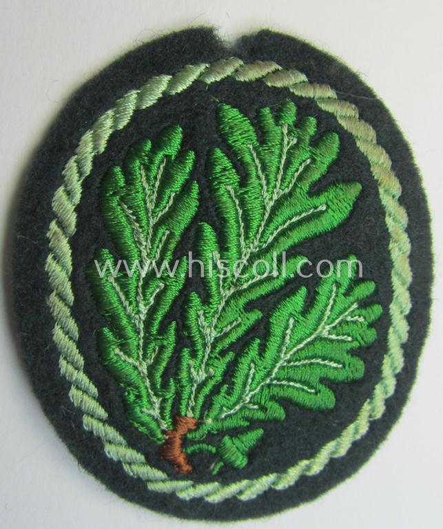 WH (Heeres) so-called: 'Jäger'-armbadge being a neatly machine-embroidered- and/or multi-coloured version as was executed on darker-green-coloured wool