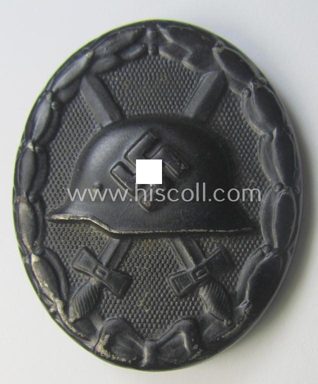 Black-class wound-badge (or: 'Verwundeten-Abzeichen in Schwarz') being a maker- (ie. '4'-) marked specimen as was produced by the maker (ie. 'Hersteller') named: 'Steinhauer & Lück'