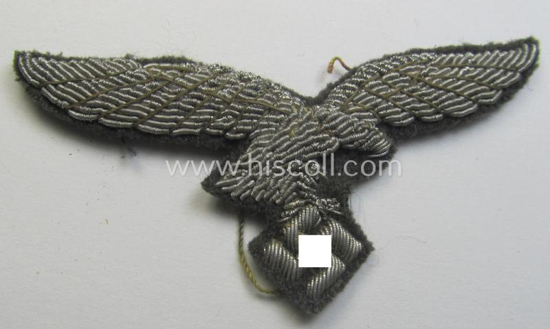 WH (Luftwaffe) officers'-pattern visor-cap-eagle (ie. 'Adler für LW-Offiziers-Schirmmütze') being a neatly hand-embroidered example of the: 'Extra Qualität' that comes in a moderately used- (ie. carefully cap-removed-), condition