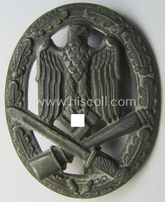 'Allgemeines Sturmabzeichen' (or: General Assault Badge ie. GAB) being a typical unmarked, zinc-based- (ie. 'Feinzink'-) and/or: 'flat-back'-version as was (I deem) produced by the: 'Rudolf Karneth'-company