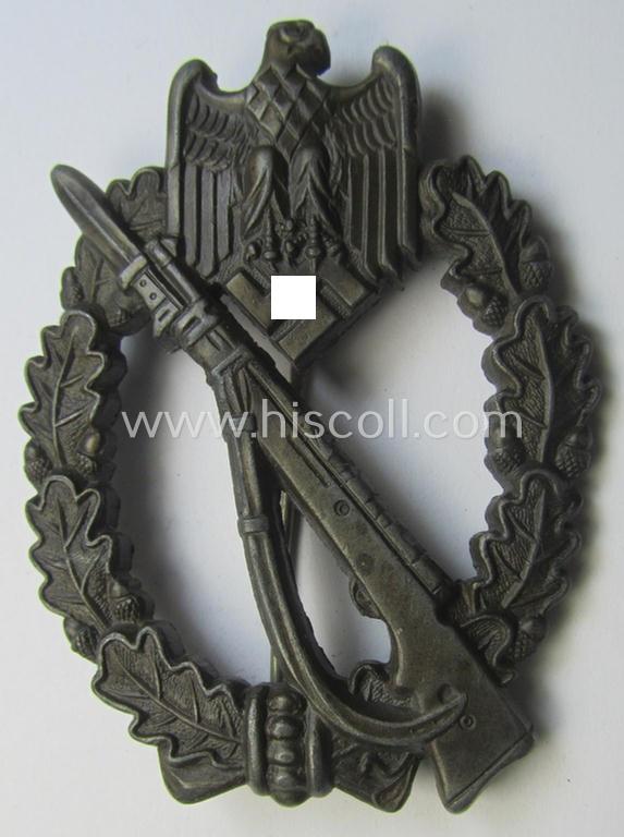 'Infanterie Sturmabzeichen in Bronze' (or: bronze-class infantry assault-badge ie. IAB) being a maker- (ie. 'AS'- ie. 'Adolf Scholze') marked so-called: 'solid-back'-example as was executed in zinc-based metal