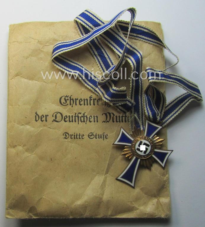 'Ehrenkreuz der deutschen Mutter - dritte Stufe' (or: bronze-class mothers'-cross) that came mounted onto its long-sized ribbon and that came stored in its period pouch (by the maker: 'Jakob Bengel - Oberstein')