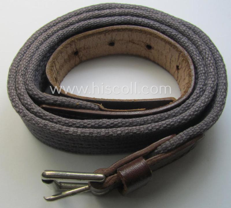 'Standard-issue'-pattern, WH trousers'-belt (or: 'Riemen für Hosen') as was executed in a combination of roughly woven blue-coloured linnen and/or brown-coloured leather