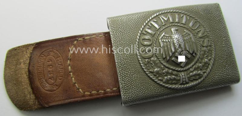 WH (Heeres) 'standard-pattern', field-grey-toned- and aluminium-based belt-buckle being a maker- (ie. 'H. Arld - Nuernberg'-) marked- and/or: '1937'-dated example that comes mounted onto its leather-based tab