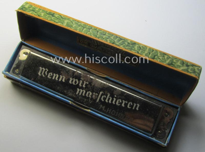 TR-era- (ie. 'Deutsche Wehrmacht'-) related harmonica entitled: 'Wenn wir Marschieren' that came stored in its original and/or carton-based box ie. etui