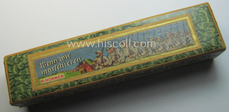 TR-era- (ie. 'Deutsche Wehrmacht'-) related harmonica entitled: 'Wenn wir Marschieren' that came stored in its original and/or carton-based box ie. etui