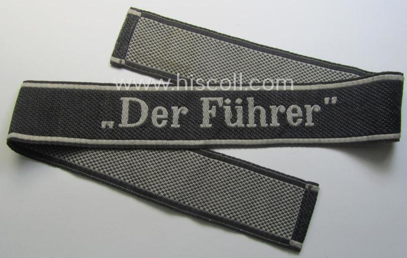 Waffen-SS, 1943-pattern cuff-title (ie. 'Ärmelstreifen') depicting the machine-woven Latin script text in silver-grey linnen as was specifically intended for usage by a member of the: 'SS-Regiment “Der Führer”