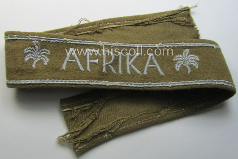 WH (LW o. Heeres) cuff-title (ie. 'Ärmelstreifen') entitled: 'Afrika' (being an example that comes in a presumably issued- albeit simply never used- ie. 'virtually mint' condition)