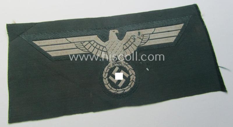 WH (Heeres) early- (ie. pre-war-) period- and/or greyish-coloured breast-eagle of the: 'M36'- (ie. 'M40'-) pattern as was executed in the 'BeVo'-weave pattern on a darker-green-coloured background