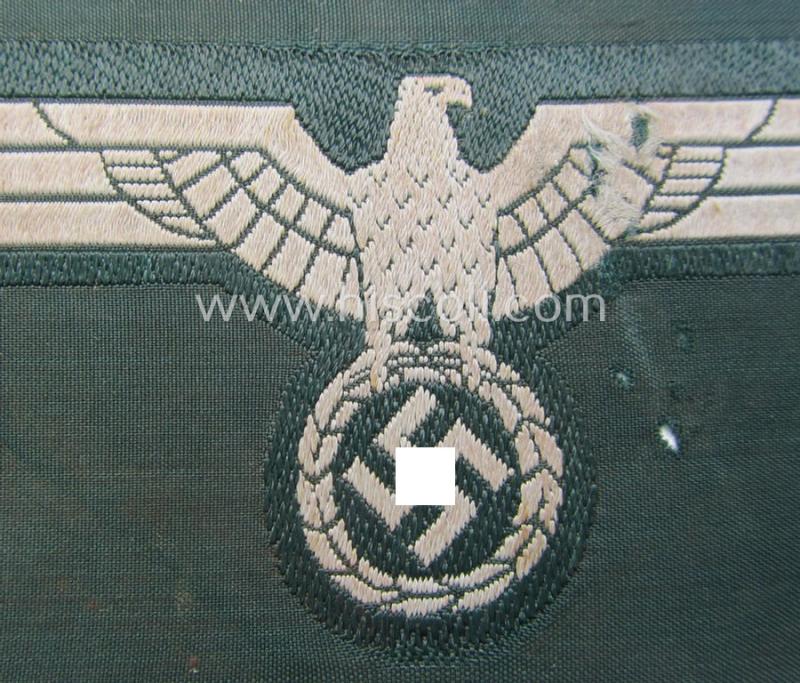 WH (Heeres) early- (ie. pre-war-) period- and/or greyish-coloured breast-eagle of the: 'M36'- (ie. 'M40'-) pattern as was executed in the 'BeVo'-weave pattern on a darker-green-coloured background