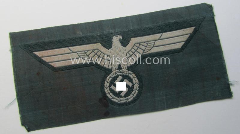 WH (Heeres) early- (ie. pre-war-) period- and/or greyish-coloured breast-eagle of the: 'M36'- (ie. 'M40'-) pattern as was executed in the 'BeVo'-weave pattern on a darker-green-coloured background