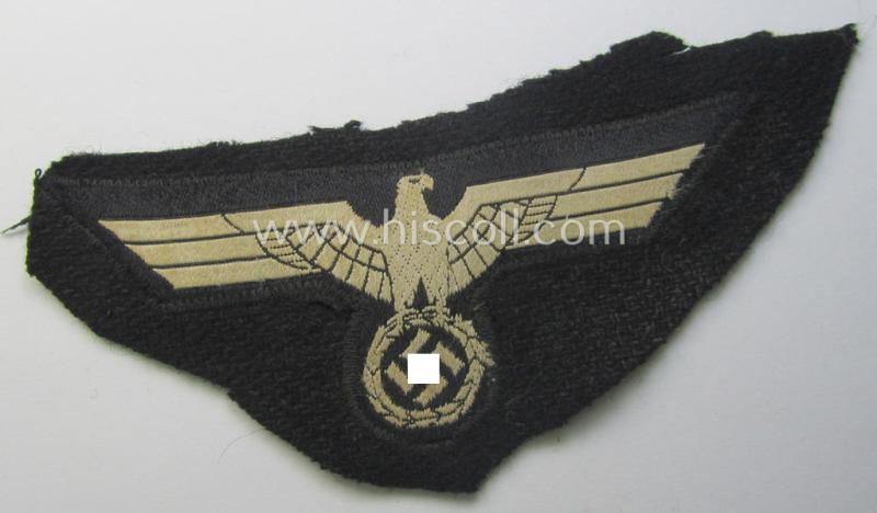 'Cut-out of a wrap-around-tunic' - WH (Heeres) 'Panzer' EM- (ie. NCO-) type breasteagle (ie. 'Brustadler für Mannschaften und Unteroffiziere des Heeres')