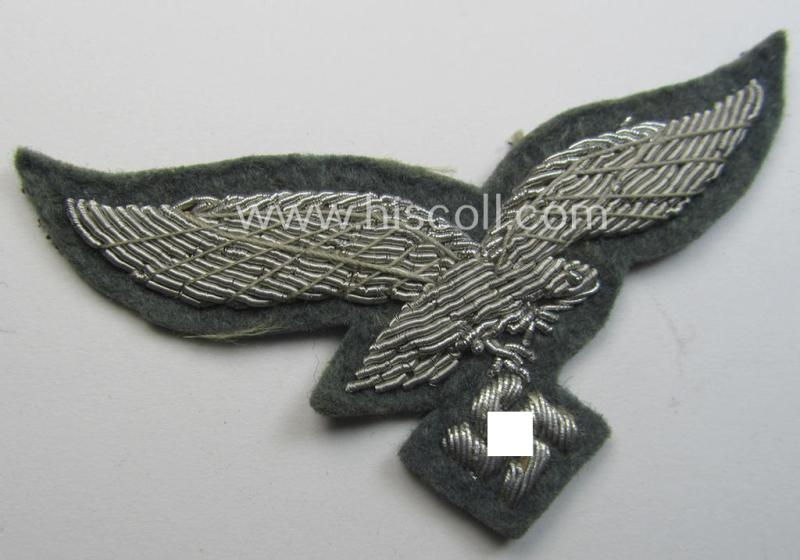 WH (Luftwaffe) officers'-pattern visor-cap-eagle (ie. 'Adler für LW-Offiziers-Schirmmütze') being a neatly hand-embroidered example of the: 'Extra Qualität' that comes in a 'virtually mint ie. unissued'-), condition