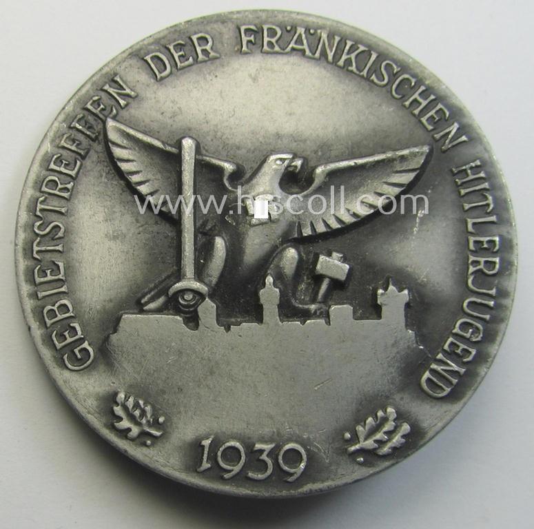 Commemorative silver-toned 'HJ'- (ie. 'Hitlerjugend'-) related 'tinnie' being a maker- (ie. 'R. Sieper'- ie. 'RzM - M9/25'-) marked example depicting a: 'HJ'-eagle-device and text: 'Gebietstreffen der Fränkischen Hitlerjugend - 1939'