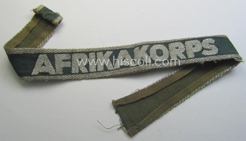 Truly worn, 'BeVo'-like cuff-title (ie. 'Ärmelstreifen') entitled: 'Afrikakorps' being a with certainty issued example that comes in an overall nice- (ie. somewhat shortened- and/or once tunic-attached-), condition